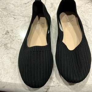 Black ballet style Danskin fabric flats.
